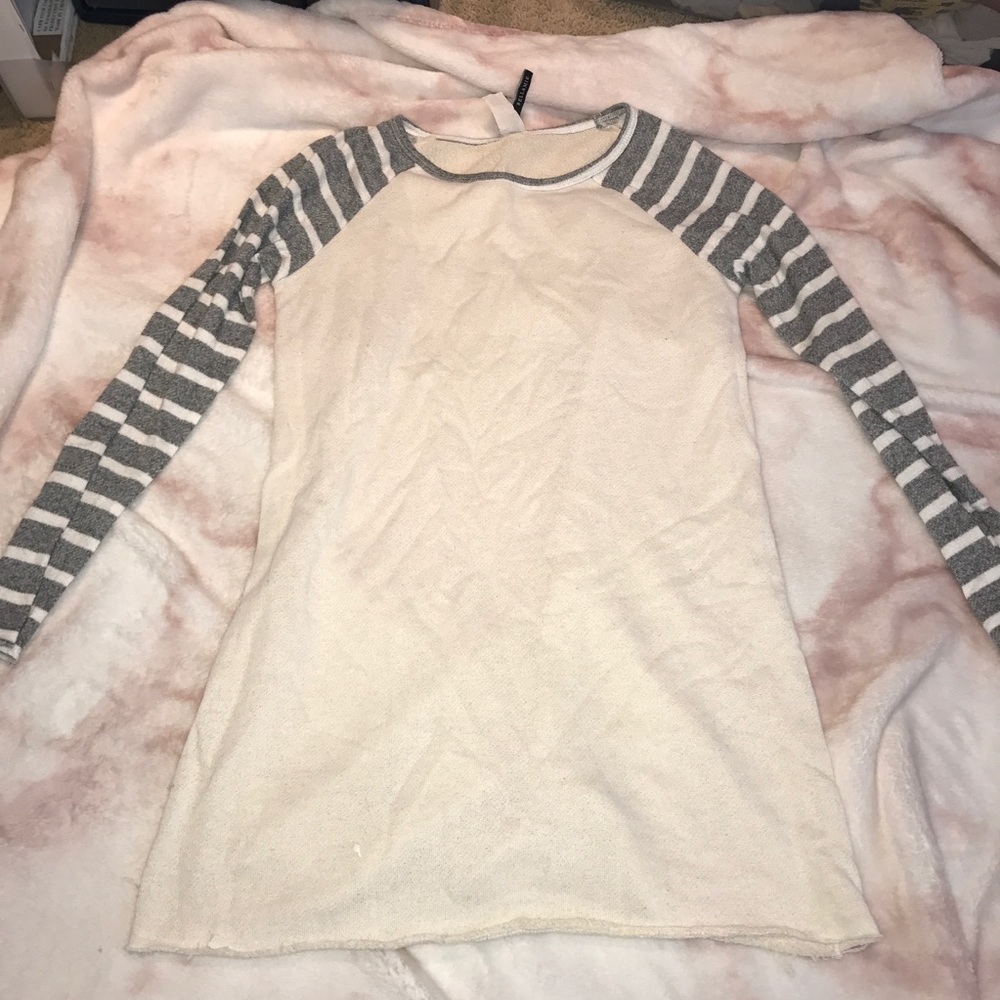 Cream sweater with striped sleeves